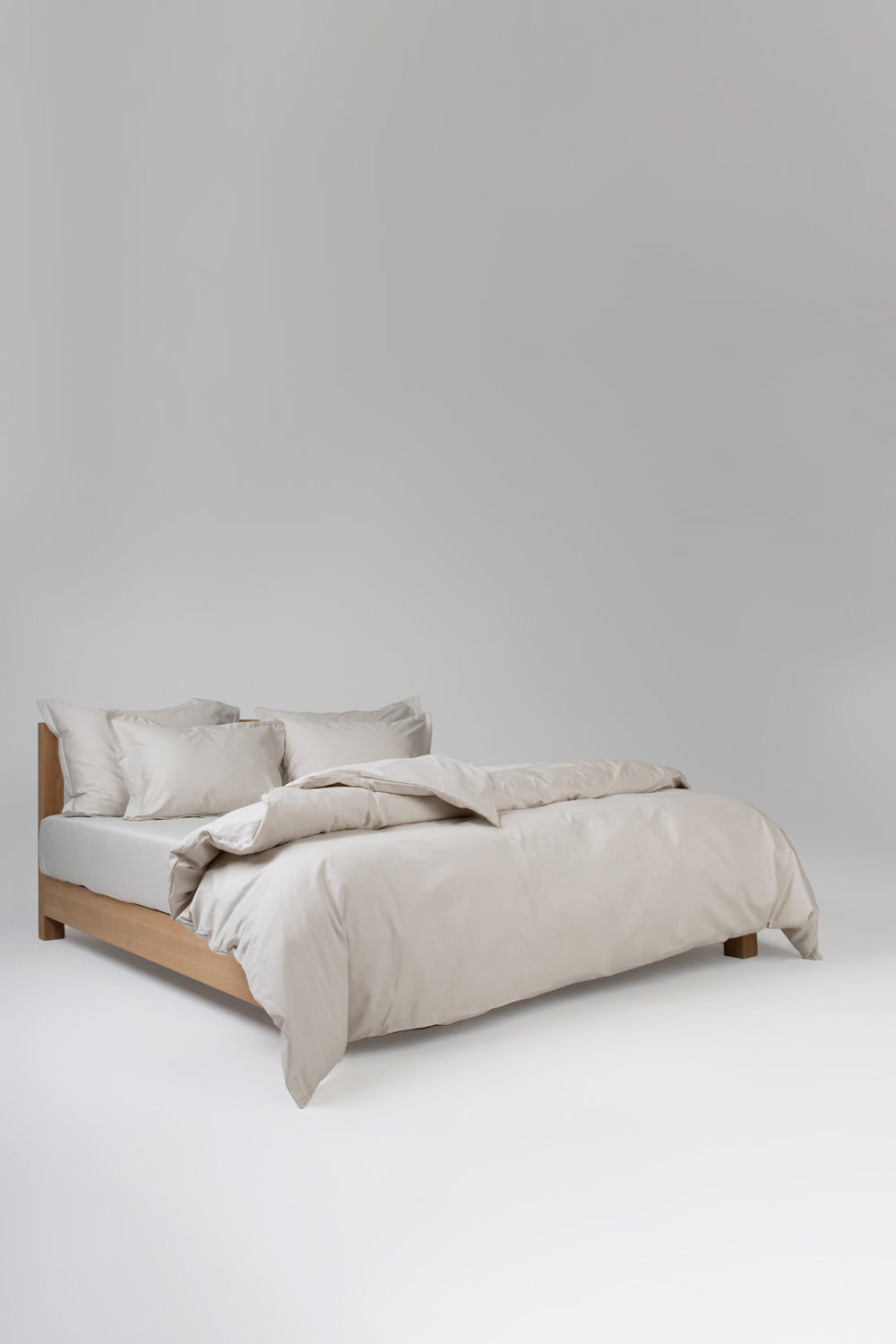 beige bedding cotton on a wooden bed
