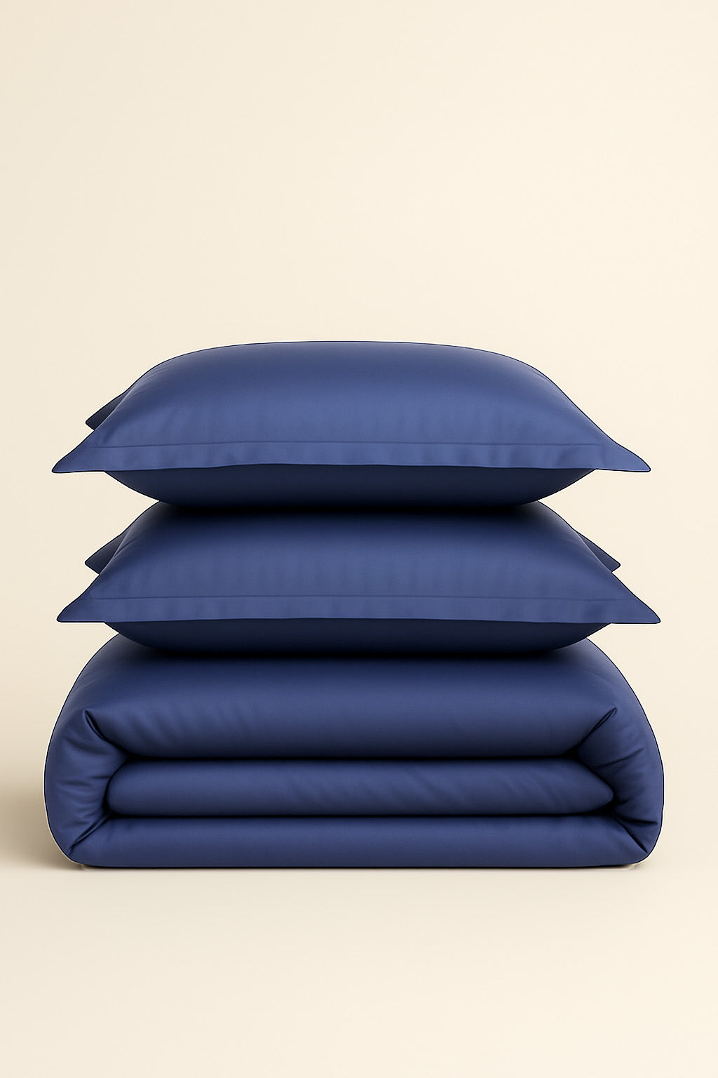 Stack of blue bedding on a beige background